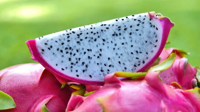 Ripe red dragon fruit placed in a bowl under natural light