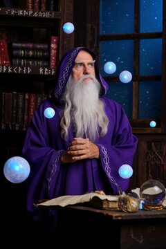 Mysterious Wizard Casting Spells with Orbs