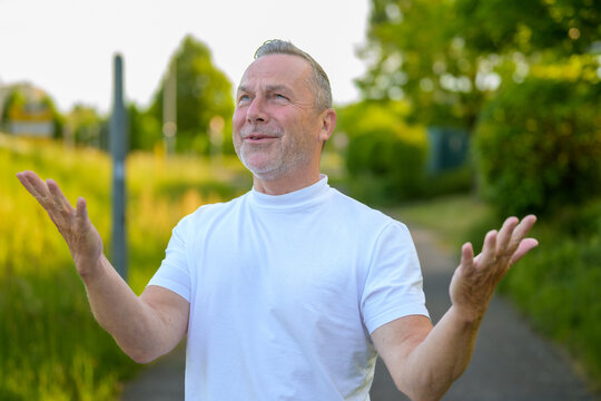 Senior Man Expressing Gratitude Outdoors