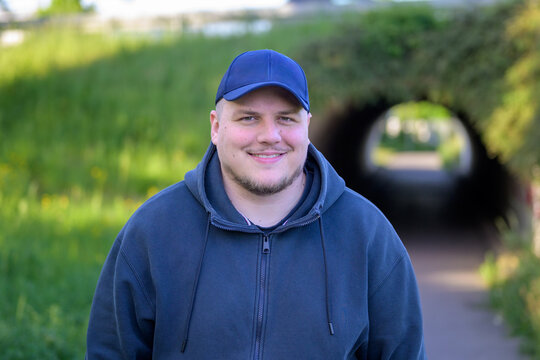 Young Man Smiling Near Tunnel