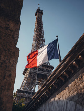 Eiffel tower and french flag waving in paris