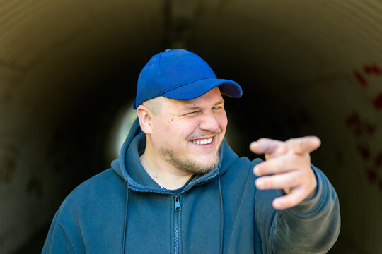 Playful Young Man Pointing Forward