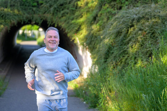 Senior Man Jogging Outdoor Smiling