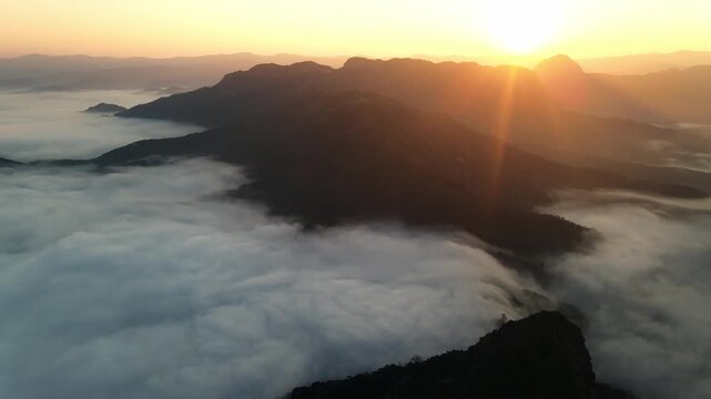 4k drone flight through passing through the mountains with sunset