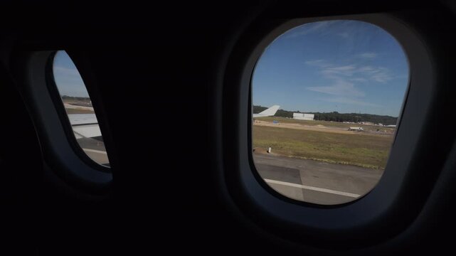 Static Airplane Window View Over Airport Runway Landscape