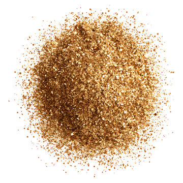 A heap of golden glitter against a white background, creating a sparkling and festive atmosphere.