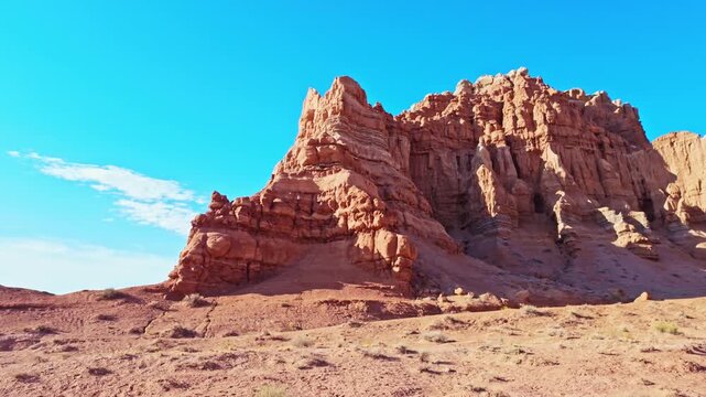 Morning sunlight illuminates unique sandstone  weathered rock formations along the Basilisk Trail in Goblin Valley State Park Utah