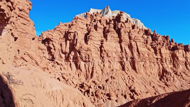 Morning sunlight illuminates unique sandstone  weathered rock formations along the Basilisk Trail in Goblin Valley State Park Utah
