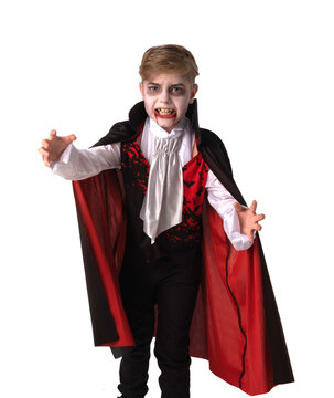 A boy dressed in a vampire costume