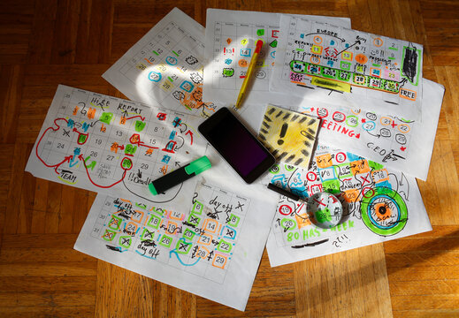 Calendar with business appointments and deadlines,pens,and paperwork on  messy workplace. Business concept beat the clock, overworked, stress. Free copy space