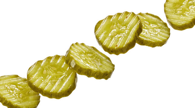 Sliced crinkle cut dill pickles arranged diagonally as isolated on transparent background