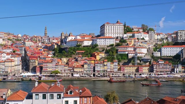 Teleferico de Gaia cable car in Vila Nova de Gaia, Portugal, above Douro River and Ribeira in Porto, with tourist boats and hillside cityscape