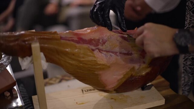 Chef Slicing Spanish Cured Jamon Serrano Iberian Ham Close Up