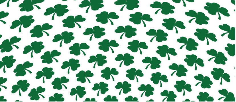 Dynamic diagonal arrangement of solid green clover leaves creating a lively seamless vector pattern on a white background. Excellent for festive party decor spring fashion prints and energetic.
