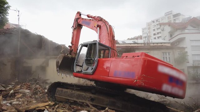 Bulldozer works on demolition project in urban area in Skopje, North Macedonia
