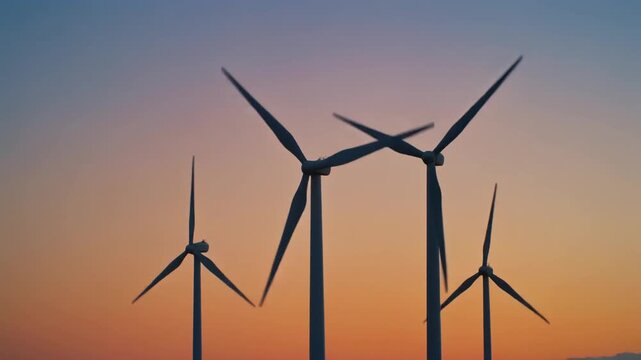 Wind Turbines Silhouette at Sunset Sky, Renewable Energy