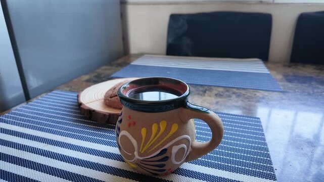 Steaming mexican coffee and concha bread for a traditional breakfast