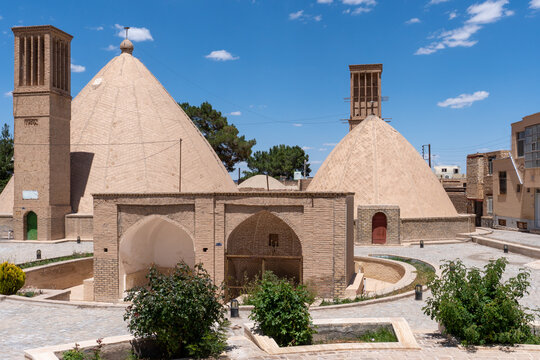 Adobe building with a windcatcher tower in Naein, Iran