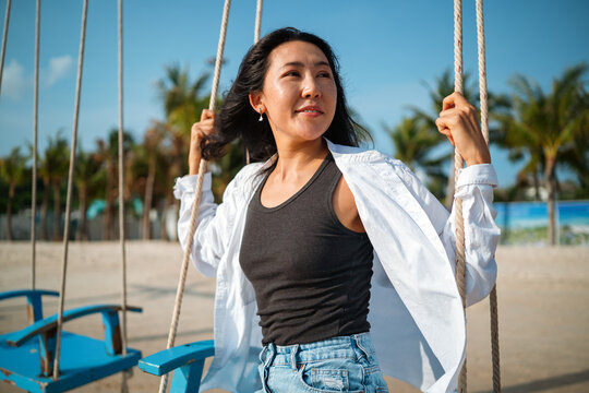 Carefree traveler feeling secure and protected while enjoying a dream vacation at a tropical beach