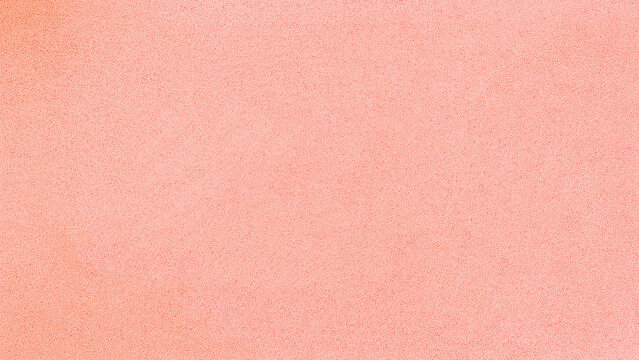 Peach pink velvet fabric texture close up with fine soft structure