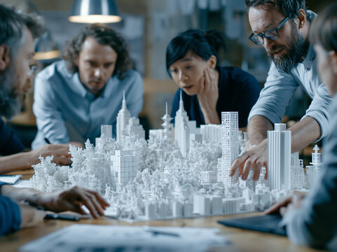 Architects and Engineers Working on City Scale Model