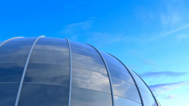 Glass dome structure rises against blue sky with curved reflective panels showing smooth architectural surfaces and bright daylight, creating futuristic building exterior view for design themes