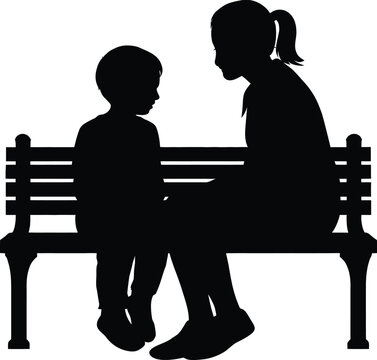 Silhouette of mother and son sitting on wooden park bench talking together.
