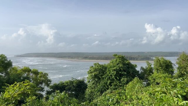 Panoramic panning view of Chapora River bay and Morjim beach coastline from Chapora Fort hill in Goa India