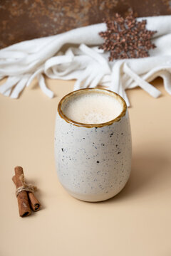 Pumpkin latte, snowflake and scarf. Warm drink during cold weather