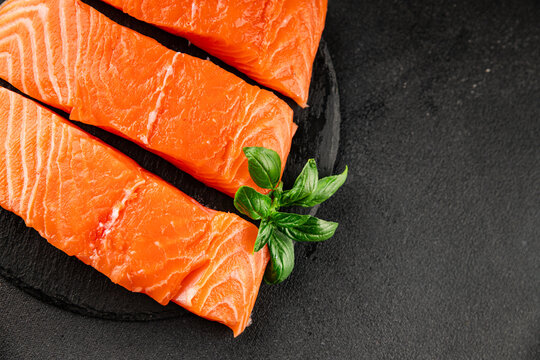 Raw salmon red fish fillet fresh seafood tasty snack &nbsp;pescetarian diet delicious gourmet food background on the table rustic food top view copy space keto and paleo diets vegetarian food
