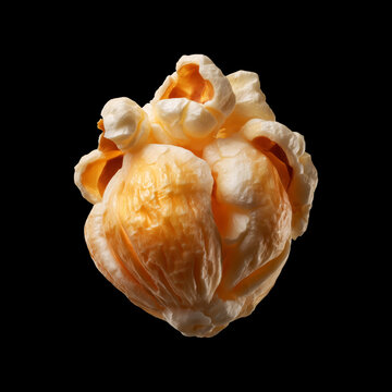 Closeup popcorn cluster kernel isolated on black background, concept of snack, food texture, crunchiness