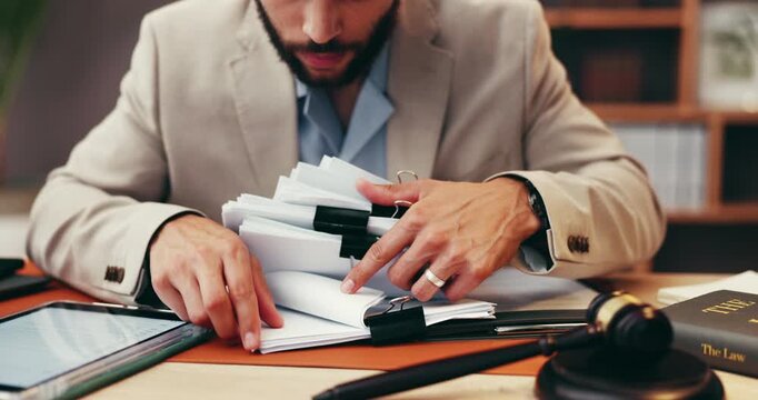 Businessman, hands or judge with paperwork for legal advice, testimonial or statements at office desk. Closeup, lawyer or attorney with documents for lawsuit, regulations or case notes at law firm