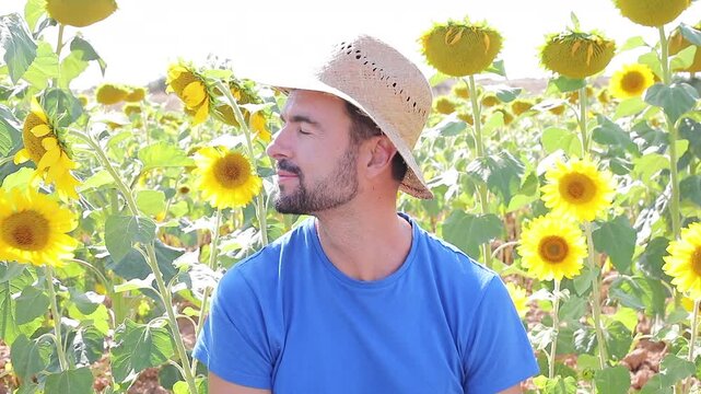 Cute farmer in sunflower field