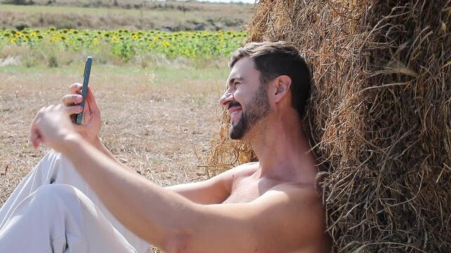 Farmer taking selfie videos in a agricultural field 