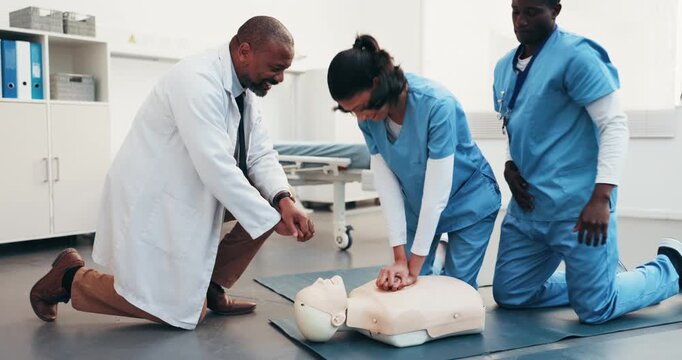 Practice, cpr dummy and doctor with students for learning first aid, rescue and medical support. Healthcare, teaching and man with compression technique for cardiac arrest, emergency care and safety