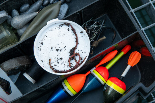 Fishing Worms and Colorful Floats in Tackle Box.