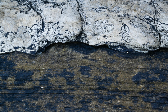 Black and white weathered natural granite stone rock background.