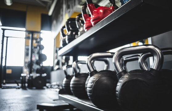 Kettlebells Lining Up In The Gym For Strength Training Equipment And Workouts