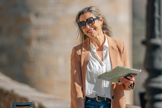 adult woman with map on the street