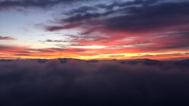 Epic sunset above the clouds with vibrant colors