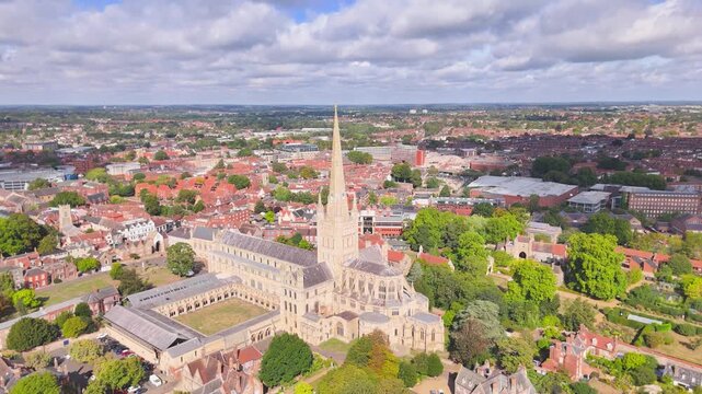 A high drone orbit movement of the historic 11th century Cathedral in Norwich, Norfolk, UK