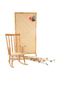 Wooden room divider and rocking chair with wildflowers