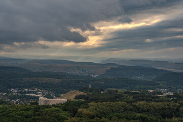 Fototapeta premium View of the mountains and Kislovodsk from the observation decks of the Kislovodsk Park. Evening sunset over the mountains of Kislovodsk.