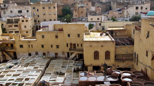 Vats of chemicals and dies in the courtyard of the Chouara Tannery in Fez, Morocco