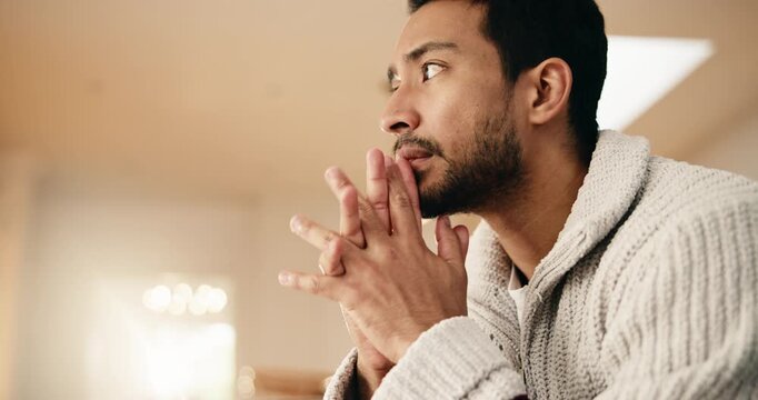 Anxiety, thinking and man on sofa in home for stress, trauma and mental health in living room. Nervous, uncertain and person with stimming for phobia, panic attack or pressure for bad news in house.