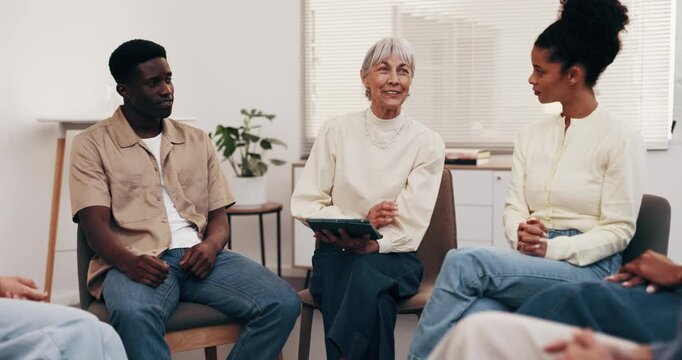 Therapist, talk and tablet in clinic with support group, wellness advice or smile for rehabilitation. Happy, counselor and people in therapy meeting with tech, conversation and tips for recovery.
