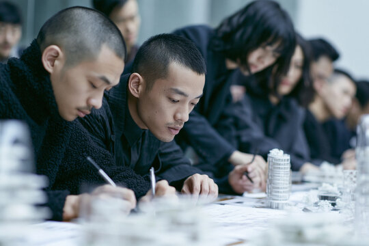 Group of Architects Collaborating on Design Project in Studio