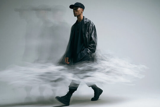 Fashionable Young Man Walking with Dynamic Motion Blur Effect