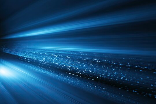 Streaks of blue light zoom into distance with bokeh effect