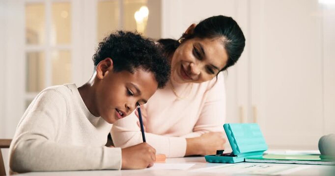 Mom, kid and writing in house with homework, learning knowledge or happy for correct answer on quiz. Woman, son and discussion in home with assignment notes, education and proud of intelligent child.